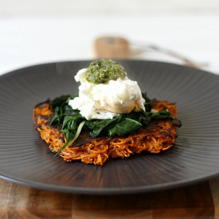 Delicious sweet potato fritters topped with garlicky greens, a poached egg and pesto